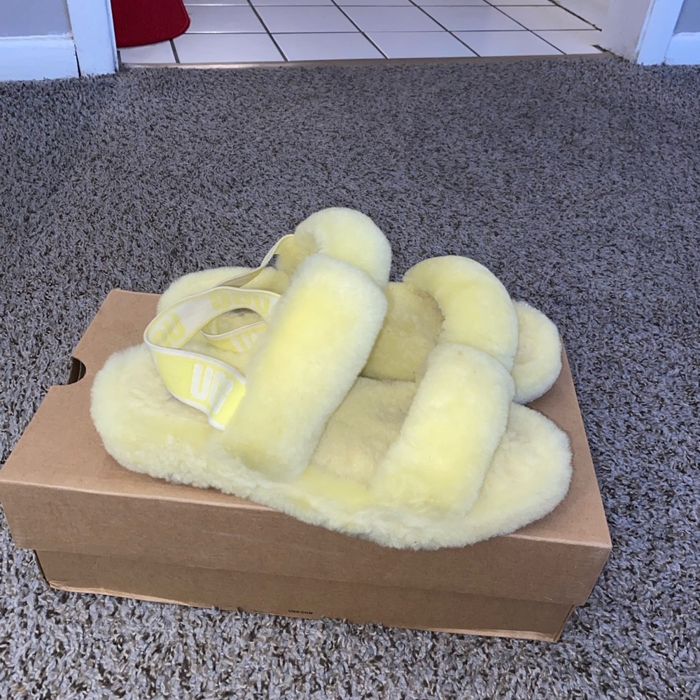Yellow ugg fur slides